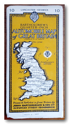 Map of part of Great Britain on a yellow background on a table.