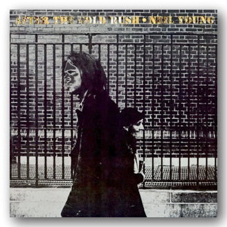 Album cover with a person against a brick wall, featuring text at the top.