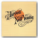 Album cover of 'Harvest' by Neil Young with a stylized title and orange circle on beige background.