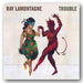 Album cover for 'Trouble' by Ray Lamontagne featuring a woman and devil figure.
