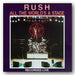 Album cover of 'All The World's A Stage' by Rush with stage and pentagram design.