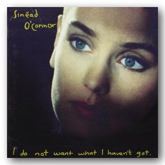 Album cover with a close-up of a person's face and text 'I do not want what I haven't got.'
