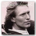 Black and white portrait of a person with 'Steve Winwood' text above, likely album cover or promotional image.