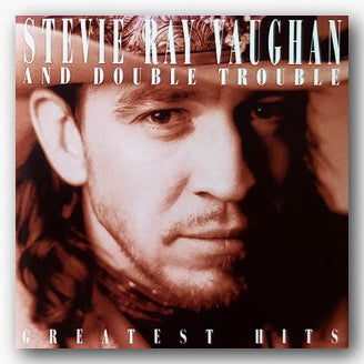 Album cover featuring a close-up of a person with text 'Stevie Ray Vaughan and Double Trouble Greatest Hits'.