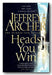 The cover of the second hand paperback book 'Heads You Win' by Jeffrey Archer, featuring a dark cityscape with a statue and a reflective surface.